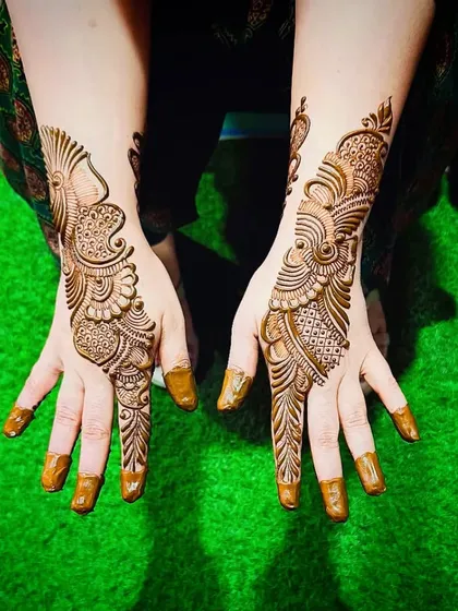 Another view of the fresh Arabic peacock design, showing the clean and precise application.