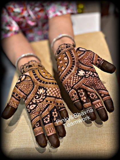 A gorgeous festive design with a mix of floral, lotus, and traditional Indian motifs. The balance of bold and fine lines makes it stand out.