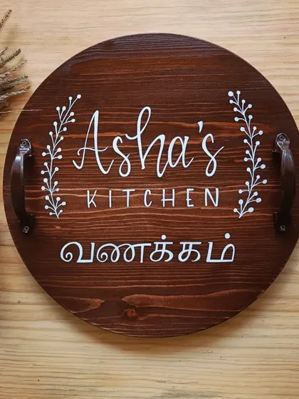 A personalized cheese board for "Asha's Kitchen," styled with natural elements to highlight its rustic charm and handcrafted quality.