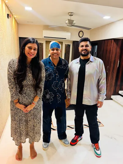 Posing with the hosts at a birthday celebration for the Gala family of Navneet books. It was an honor to bring my pizza experience to such a special family event.