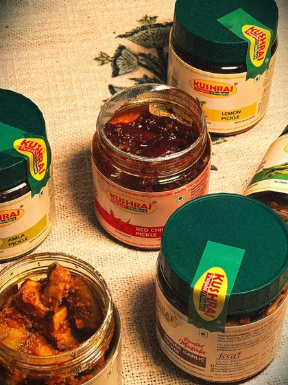 A glimpse of the variety I offer. Here you can see open jars of my Mango, Red Chilli, and Ginger Garlic pickles, showing the rich texture and real ingredients I use. It's the true taste of Punjabi 'ghar ka swad'.