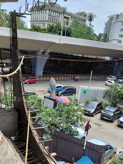 On-site at the BKC project, checking the alignment and position for the balcony moulds against the backdrop of the city.