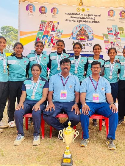 Our girls' team with their coaches, celebrating a silver medal win at the Netball State Games 2025 in Mangalore.