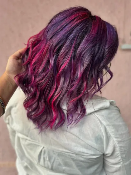 Bringing the light with this purple and pink beauty. This is a full transformation with a fresh cut and a vibrant color melt, using bleach to get these bright, beautiful shades.