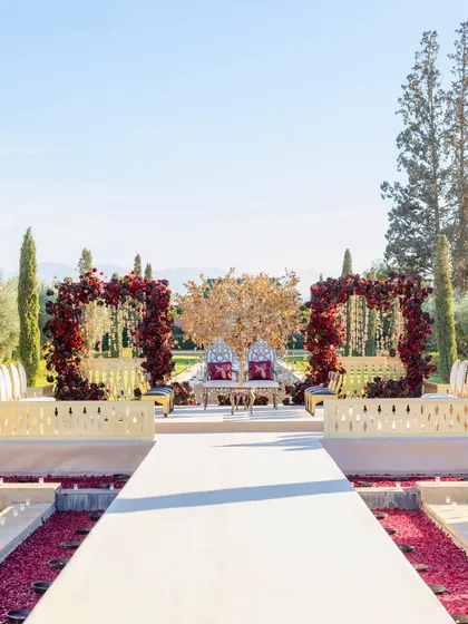 We believe a wedding should be an escape. For this Hindu ceremony, we created a fairytale setting at The Oberoi, Marrakech, with the snow-capped Atlas Mountains as a witness. The aisle was a grand canal, and the mandap featured a regal gold tree, blending Indian tradition with Moroccan splendor.