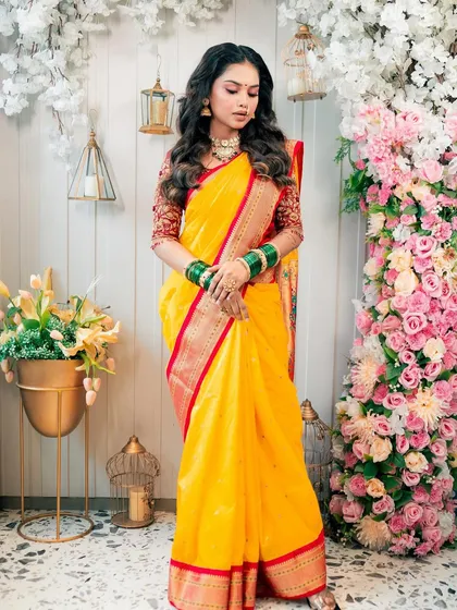 Full-length view of a traditional yellow saree look, perfect for a Maharashtrian pre-wedding ceremony.