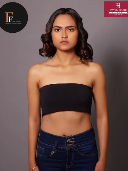 A full body shot of the model, showing how the simple makeup and hair complement the overall look.