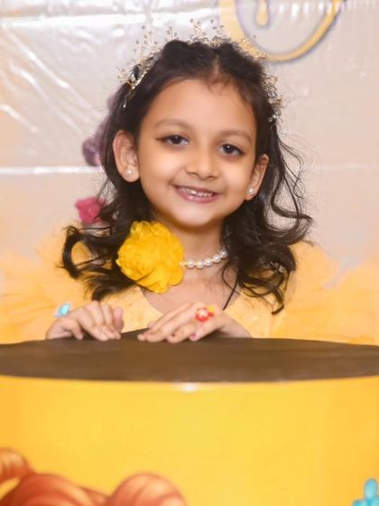 A charming 'Little Man' themed first birthday party, with a sophisticated black and white color scheme, mustache props, and a stylish backdrop, perfect for a dapper celebration.