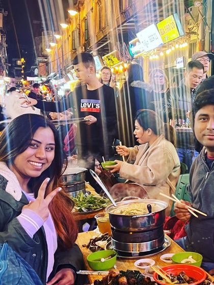 Another shot from my street food adventure, sharing a meal with a friend and soaking in the local culture and flavors.