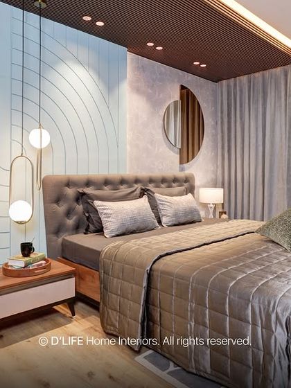 This bedroom in Madurai showcases artistic brilliance with its unique wall design, combining textures and patterns. The space is both vibrant and cozy, a perfect example of contemporary design.