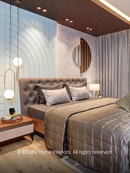 This bedroom in Madurai showcases artistic brilliance with its unique wall design, combining textures and patterns. The space is both vibrant and cozy, a perfect example of contemporary design.