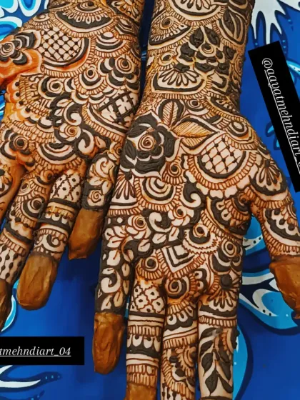 This is a classic, full-coverage bridal design with a mix of floral and traditional Indian patterns. Bookings are open to make your mehendi a beautiful moment.