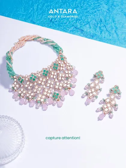 This exclusive bridal set is a piece of artistry designed to capture attention. The intricate lattice of Polki diamonds is accented with emeralds and soft pink gemstone drops, a testament to unmatched elegance.