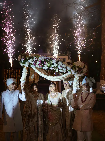 A bride's entry under a 'phoolon ki chadar' is a timeless tradition. I elevate this moment with coordinated cold pyrotechnics, making her walk towards her new life feel truly magical and celebrated.