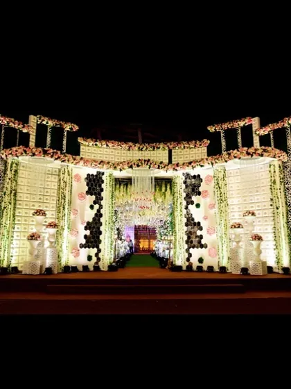 This is the full view of the grand entrance facade, a monumental structure that sets a tone of pure elegance. The design uses lighting and architectural depth to create a powerful first impression.