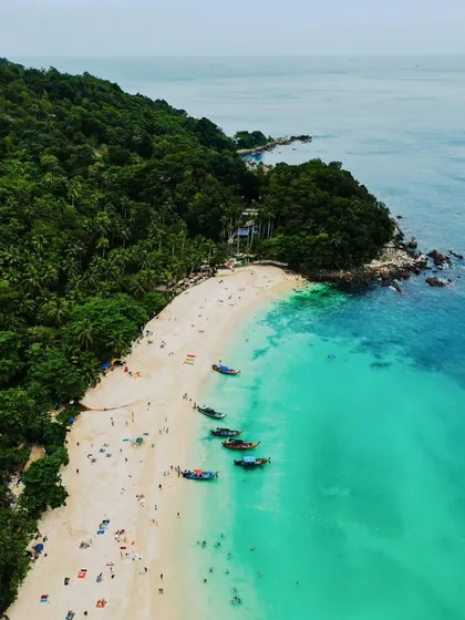 An aerial view of the stunning turquoise waters and white sand beaches of Phuket, Thailand. My coastal aerial photography aims to capture the paradise-like quality of these destinations for tourism brands and travel lovers.