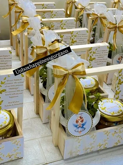 A wide shot of a bulk order for baby girl announcement baskets. The consistent gold and white butterfly theme creates an elegant and cohesive look for sharing your news.