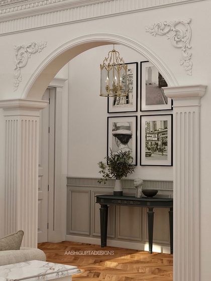 An architectural detail showing a beautifully crafted archway with ornate corner mouldings. This is how I frame views and create elegant transitions between spaces, adding a layer of classical refinement.