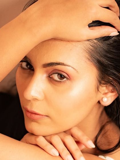 An intense and captivating close-up. The direct eye contact and minimal setting create a powerful portrait.