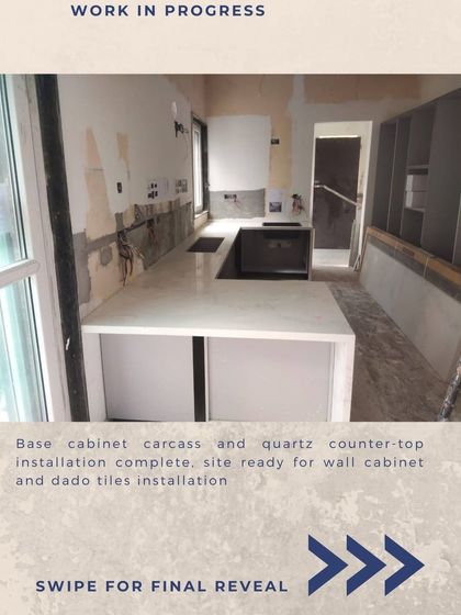 The new base cabinets and quartz countertop are installed. The site is now ready for the wall cabinets and backsplash tiles, and the new kitchen is starting to take shape.