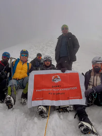 Done! Our team with the banner at the summit of Friendship Peak, 17,346 ft. The fog can't hide the feeling of accomplishment.