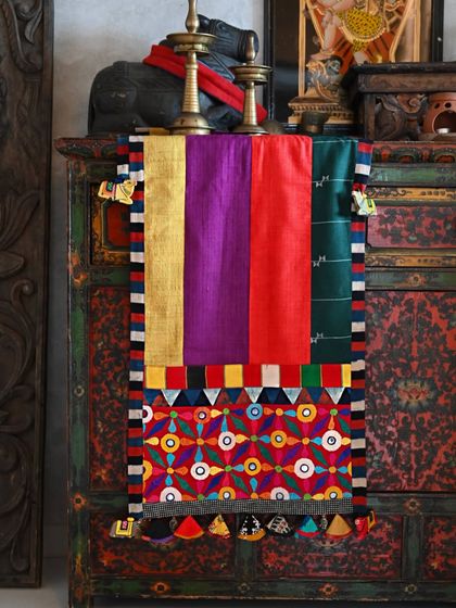 The full view of the patchwork runner with Sindhi embroidery, a vibrant piece made from strips of textured Kala cotton and Matka silk.