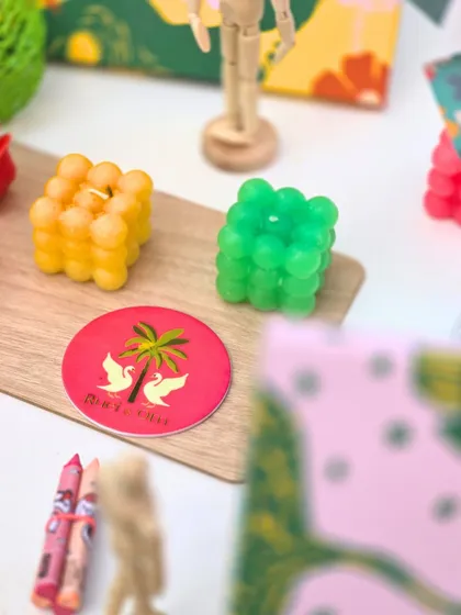 A close-up of the bubble candles and custom coasters, showing how even the smallest details were designed to fit the artistic theme.