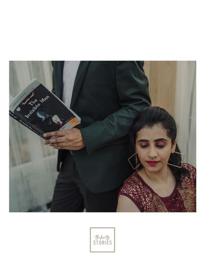 A creative and quirky shot that reflects the couple's personality. Using a book as a prop adds a unique storytelling element to their contemporary pre-wedding shoot.