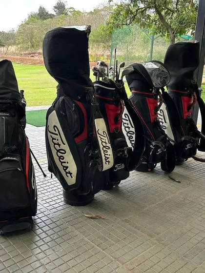 A lineup of Titleist golf bags at our driving range. We can advise you on the best bag for your needs, whether you prefer to carry, use a pushcart, or ride in a cart.