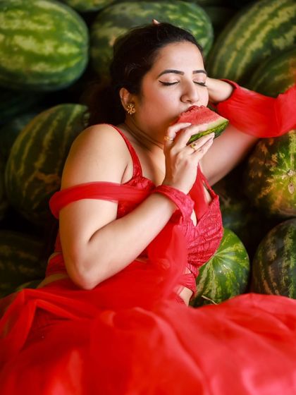 A creative and vibrant summer-themed shoot with an actress in a red outfit surrounded by watermelons. This series is playful and colorful, perfect for a brand campaign or a unique portfolio piece.