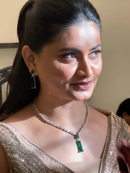 A candid shot showing how the makeup looks from different angles. The skin appears luminous and the eyes are beautifully defined.
