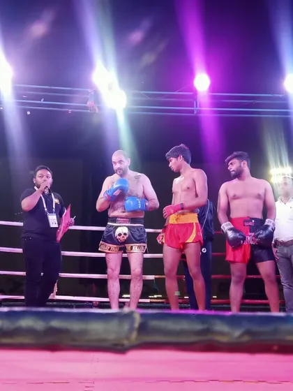 The pro fighters being introduced in the ring before the championship bouts begin.