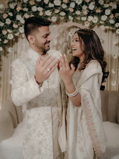 The pure, unscripted joy right after the rings are exchanged. This candid shot captures the couple's excitement and happiness in its most authentic form.