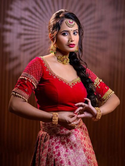 This series features a model in a red lehenga, wearing a simple but elegant gold-toned choker set. This is a great option for a pre-wedding puja or sangeet.