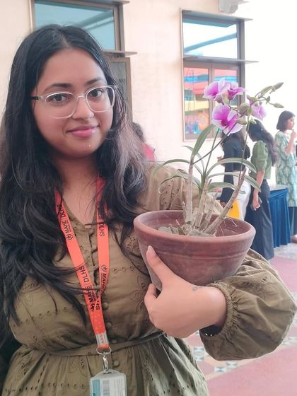 This student was so happy to get her own orchid plant at a college event we did. It's always amazing to see the younger generation get excited about plants.
