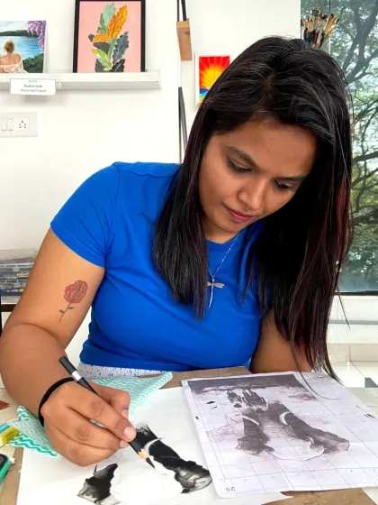 This student is learning to use charcoal, exploring its unique properties for shading and creating rich, dark tones.