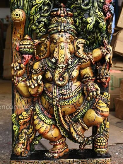 A close-up of the 36-inch dancing Ganesha from our Jali work panel. The yellowish hue combined with other colors creates a divine glow, highlighting the deity's joyful form.