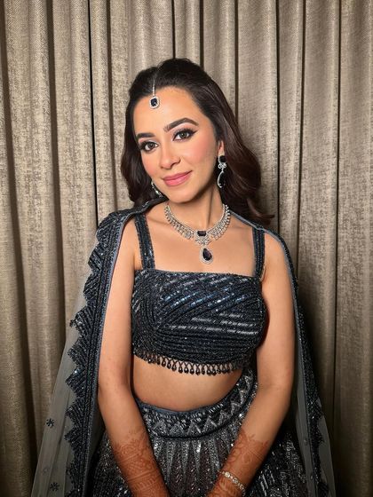 Another angle of this sangeet glam, highlighting the flawless skin and the way the makeup catches the light.