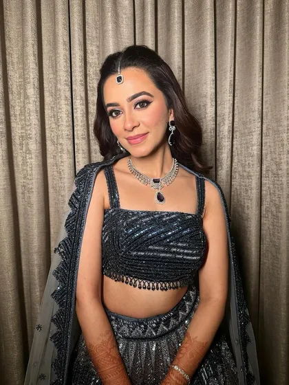 Another angle of this sangeet glam, highlighting the flawless skin and the way the makeup catches the light.