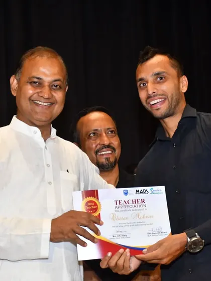 Chetan Nohvar, founder of the School of Self Defence Foundation and our taekwondo partner, receives a teacher appreciation certificate for his invaluable contribution to our students' development.
