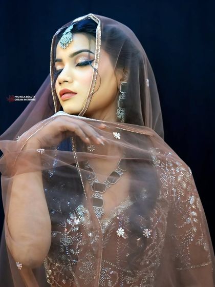 A final shot of this elegant look. The makeup is soft, romantic, and utterly timeless, perfect for creating unforgettable memories.