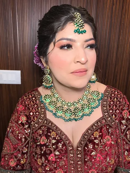 Another shot of the bride, with a purple flower in her hair adding a pop of color.