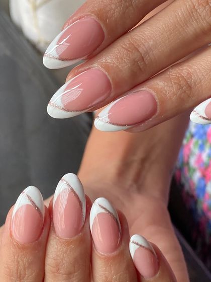 A full view of the white French with a rose gold glitter wave. It's a subtle but stunning upgrade to a timeless look.