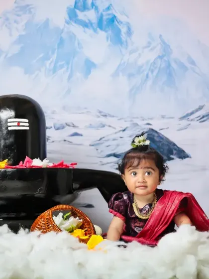A sweet baby girl dressed as Maa Parvati in our serene and beautiful Shivling setup.