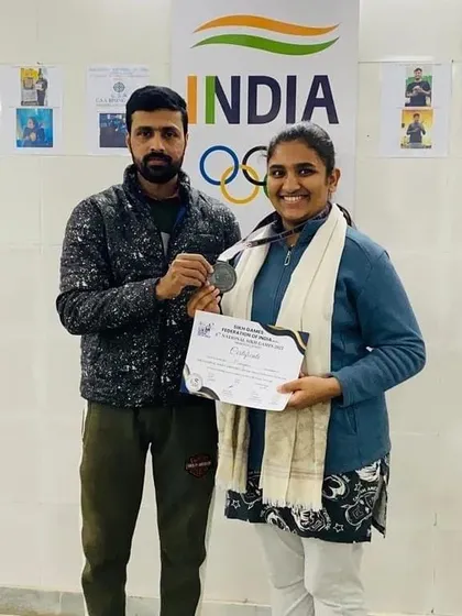 Congratulating my student Maryam on her win. Individual recognition and encouragement are key parts of my coaching style.