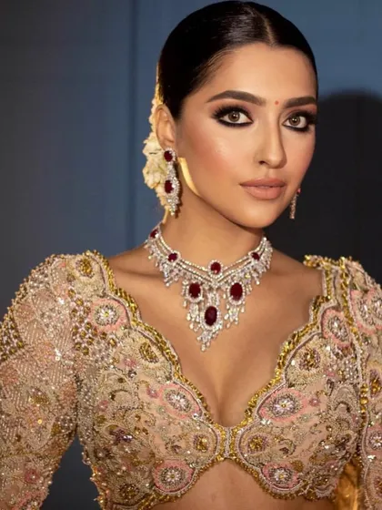 A full-face portrait of the regal reception look, showing the balanced and harmonious makeup.