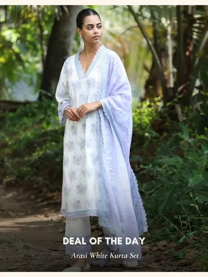 The Arasi White Kurta Set, a beautiful and serene piece featured as a deal of the day. The lavender dupatta adds a soft touch of color.
