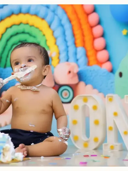 A joyful cake smash moment from our rainbow-themed first birthday shoot. We love capturing the pure delight as they dig into their very own cake.