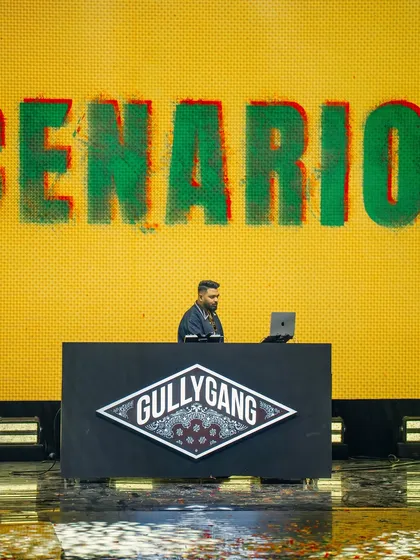 On the decks representing Gully Gang at the YouTube FanFest. This shot captures me in my element, focused on the music and the moment, with the iconic Gully Gang logo backing me up.