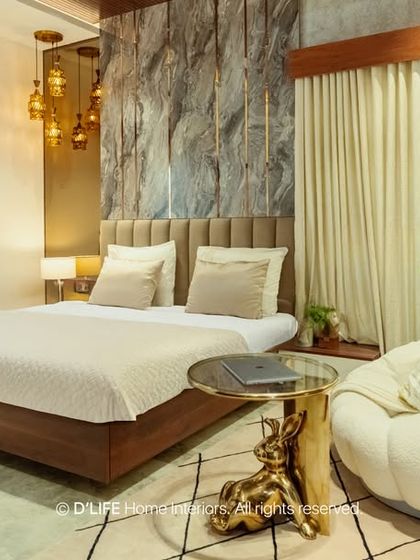 This cozy bedroom features a stunning textured stone accent wall behind the bed. Warm pendant lighting and a comfortable bean bag create a perfect corner for relaxation.